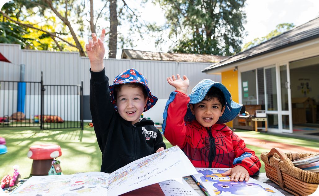 Children enjoying an outdoor learning activity at Kinder Academy