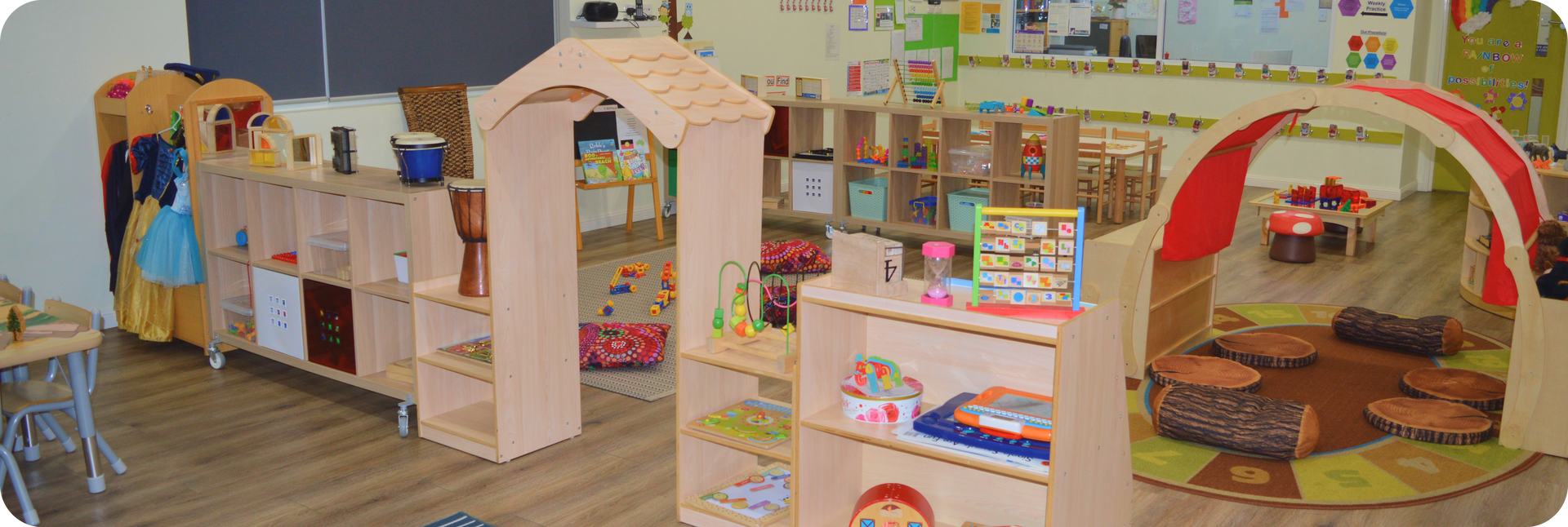 Children building with wooden blocks at Kinder Academy