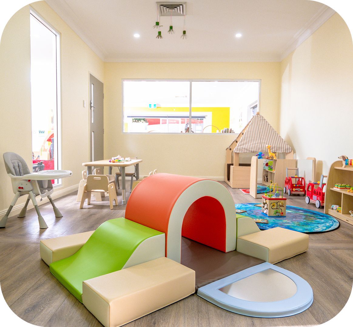 Indoor play area with soft play equipment at Kinder Academy
