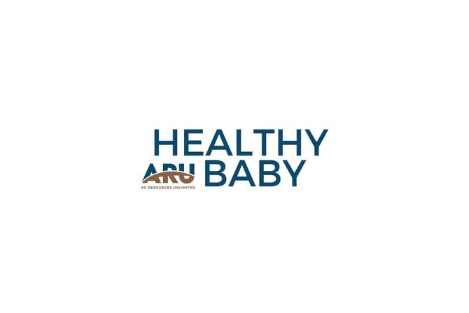 White syringe-shaped tube labeled “Start and Baby” on a wooden surface