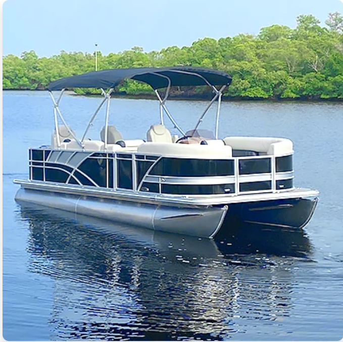 Pontoon boat on water with a black canopy and black and silver accents, trees in the background.