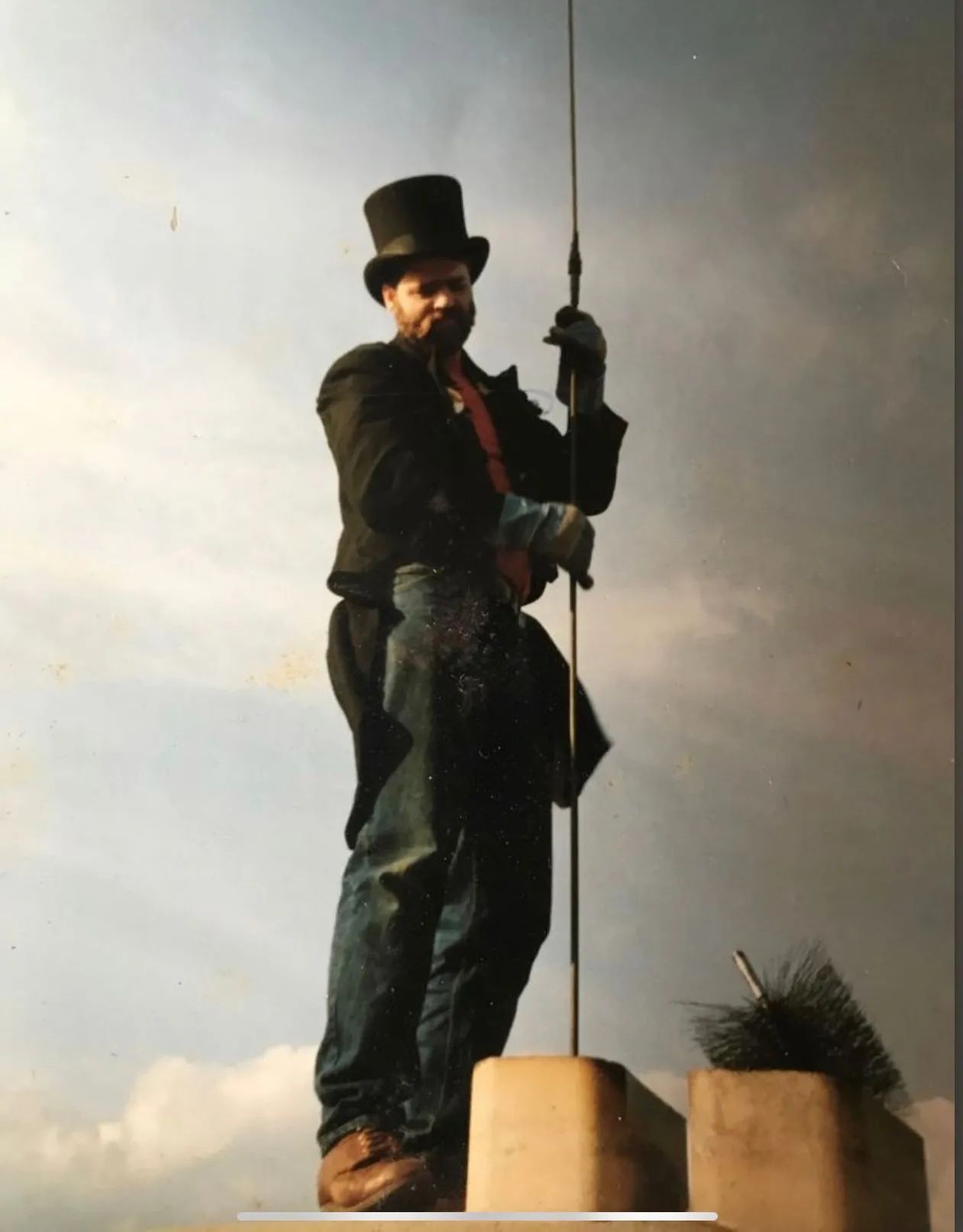 A man is working on a chimney.