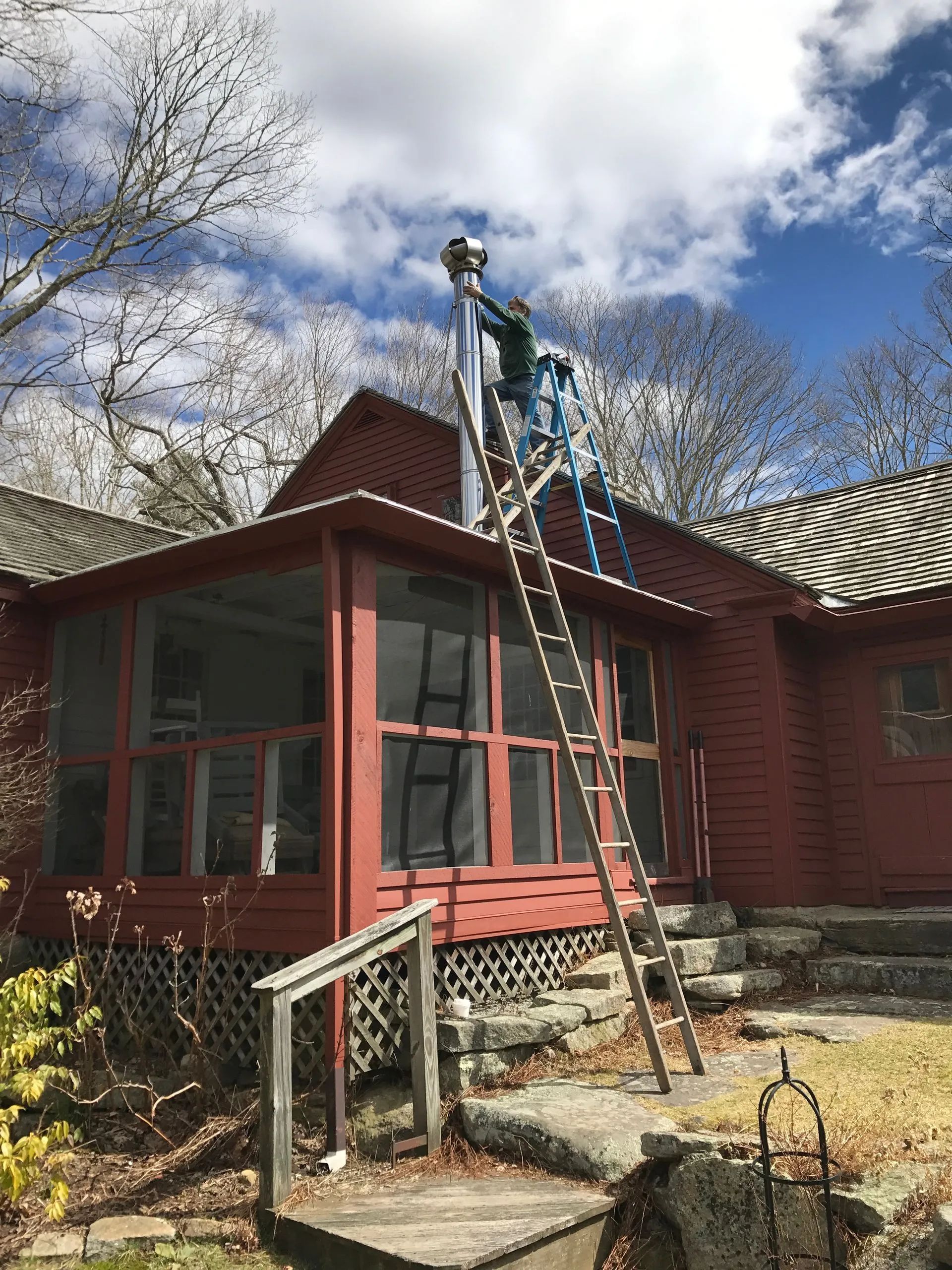 A worker fixing a chimney.