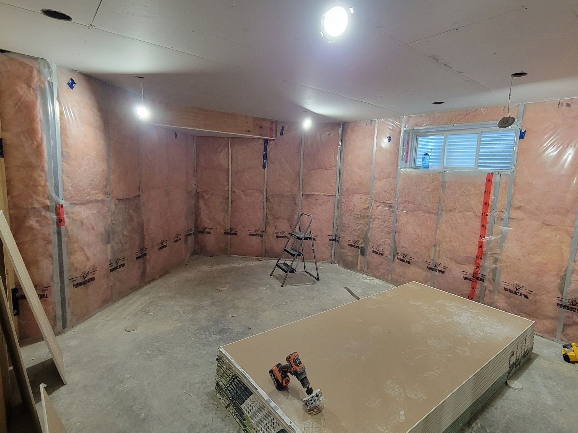 Insulated basement walls with vapour barrier before drywall in an Edmonton home