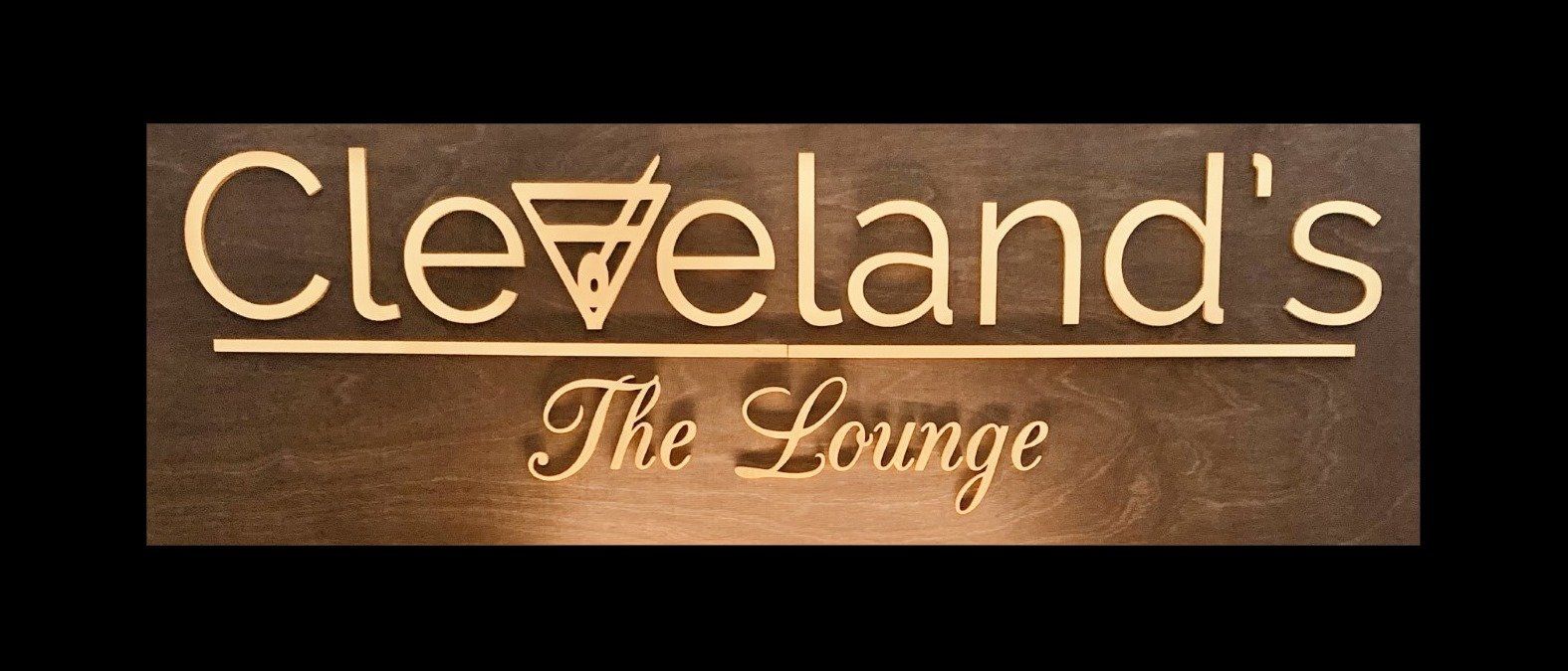 Cleveland's The Lounge sign. Tan text on a brown background.