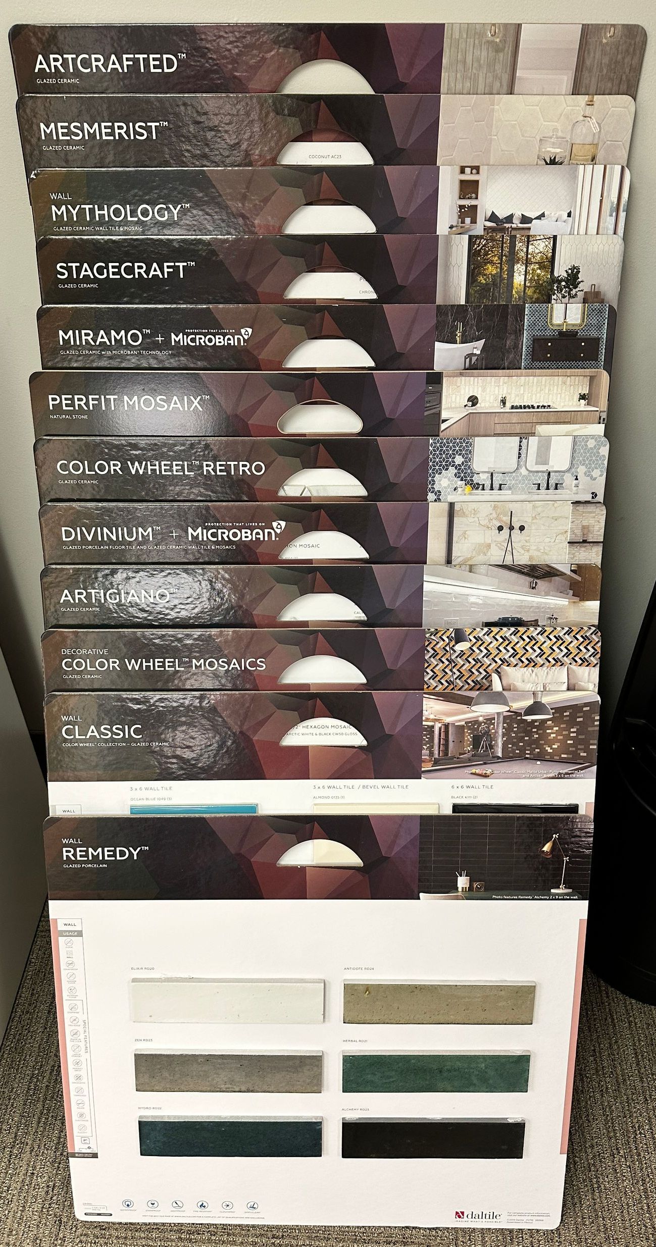 Stack of material sample booklets with color swatches visible at the bottom.