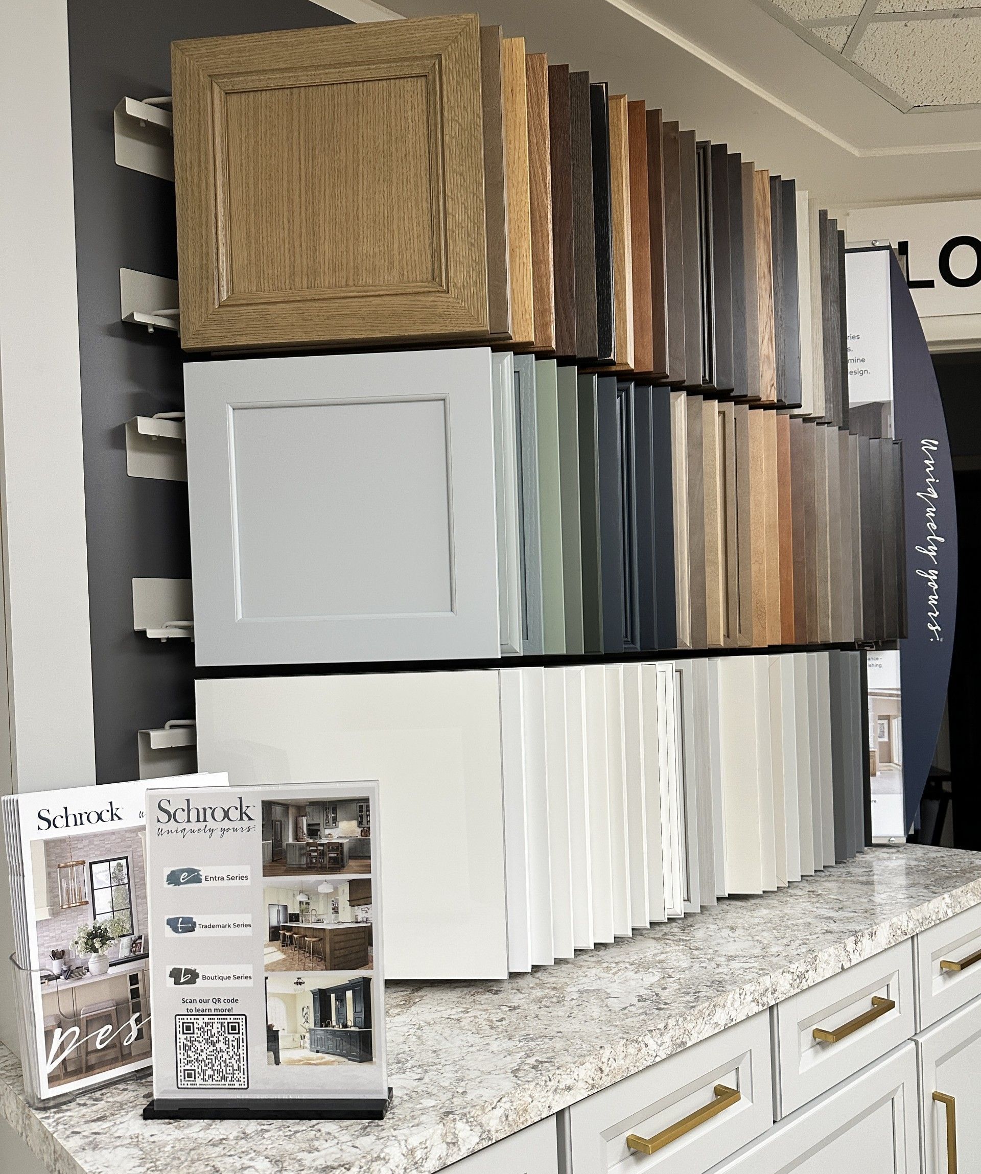 Cabinetry samples in various colors and styles displayed in a showroom.