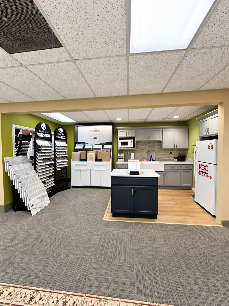 Kitchen cabinetry showroom featuring various cabinet styles and countertops.