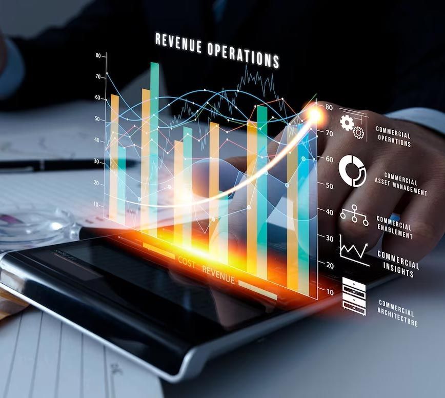 A person is holding a smart phone with a graph on it that says revenue operations