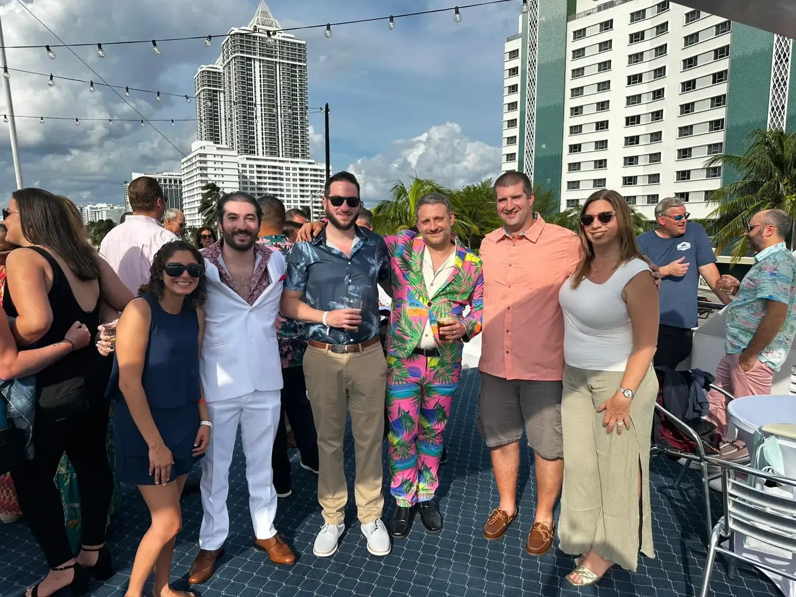 A group of people are posing for a picture on a boat.