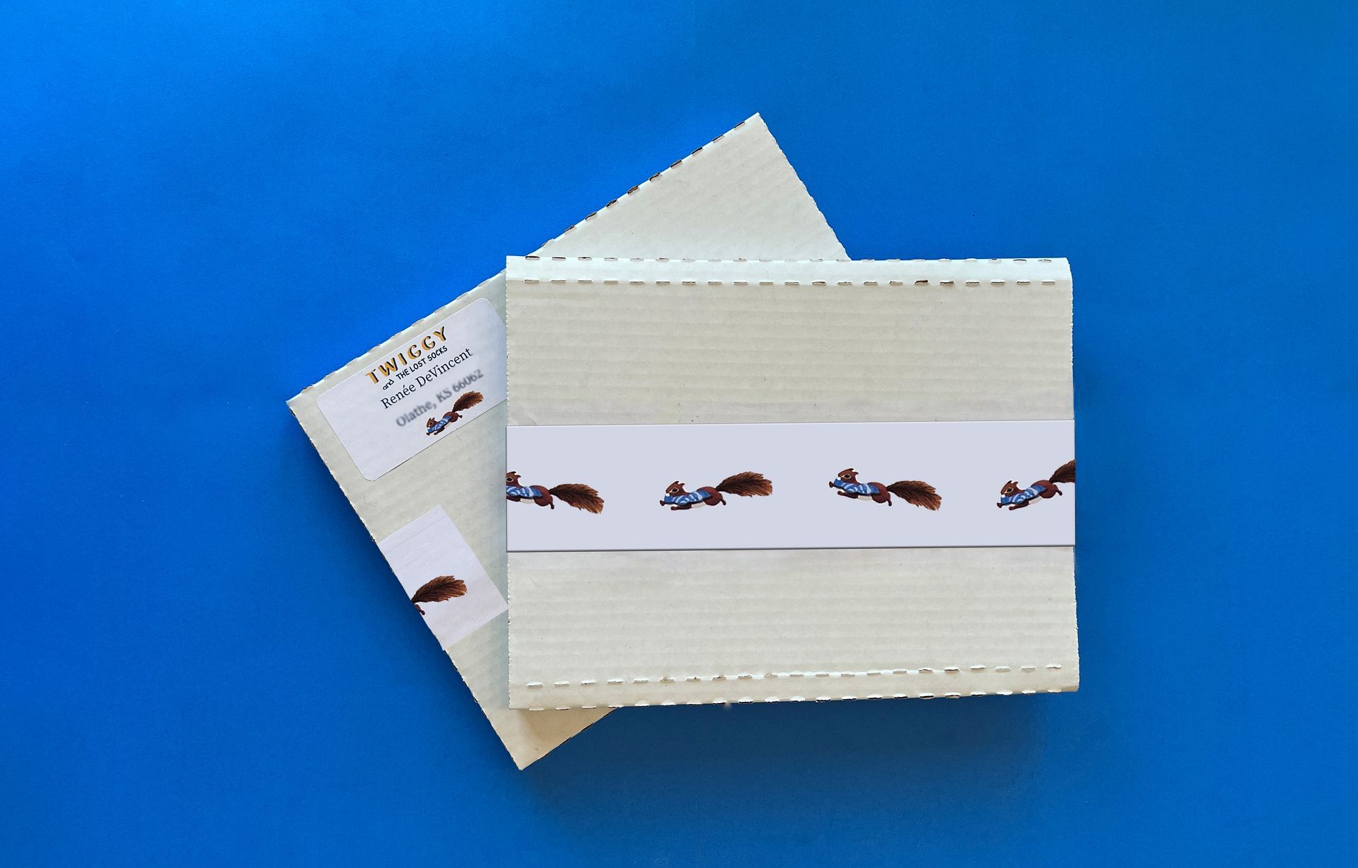 Stack of cream-colored fabric squares with a decorative band, on a blue background.