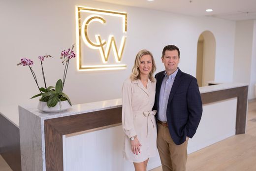 Dr. Carson Williams and his wife, Rachel at their facial plastic surgery office in Leawood KS