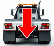 A tow truck with a red arrow pointing down