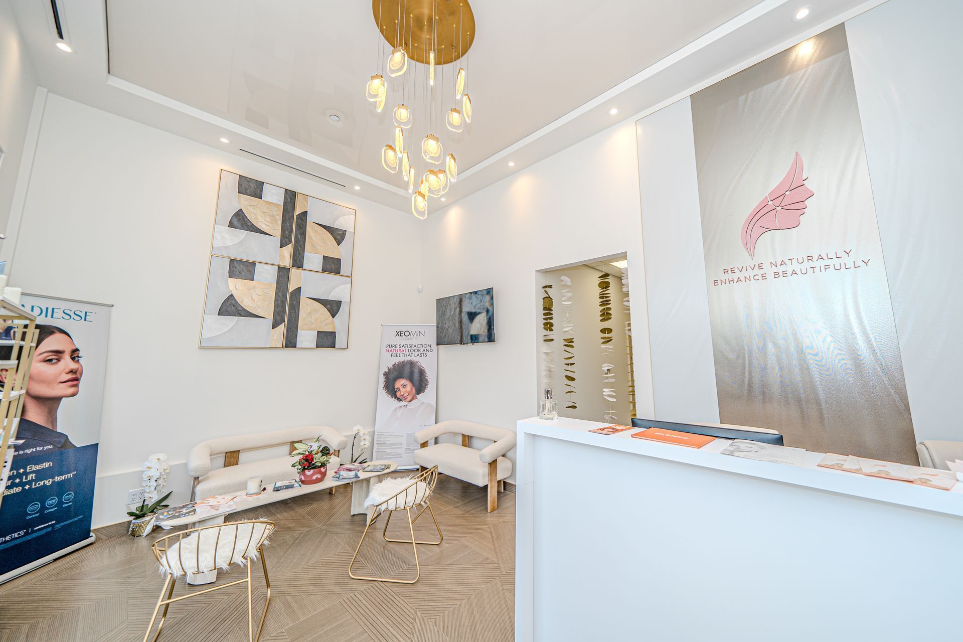 A waiting room in a beauty salon with a chandelier hanging from the ceiling.
