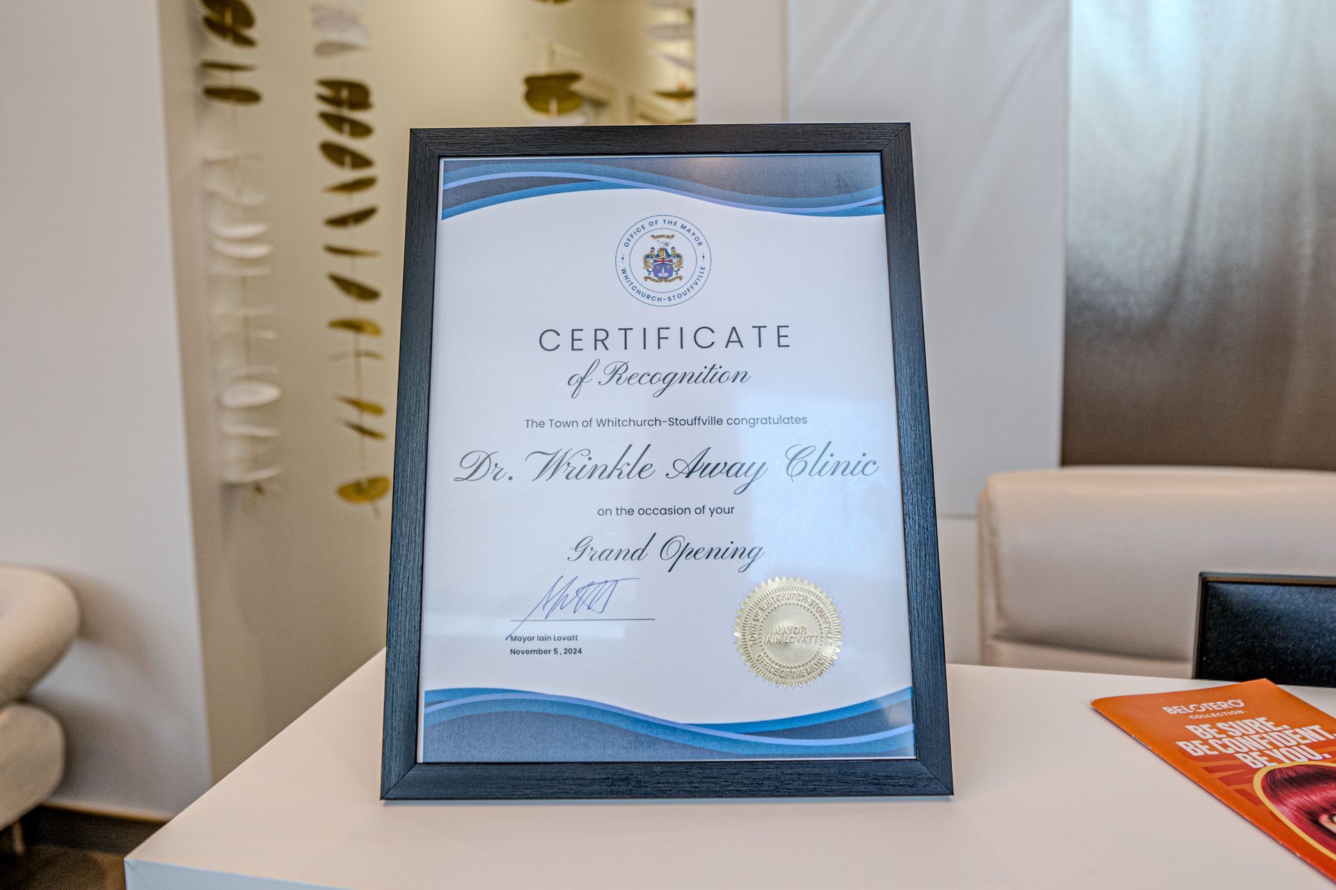 A certificate of recognition is sitting on a table