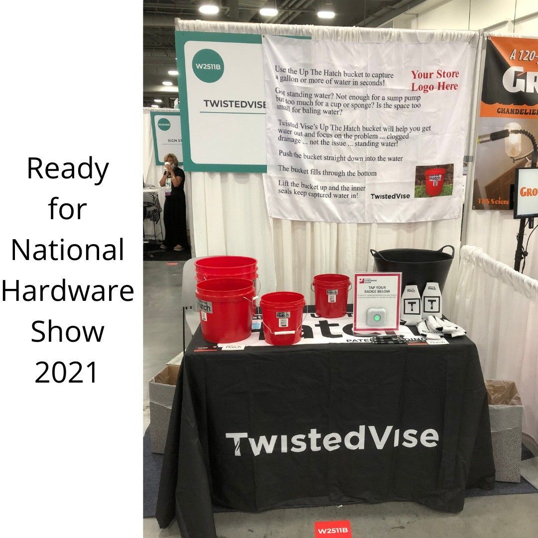 TwistedVise booth at National Hardware Show 2021 with red tools on a black tablecloth