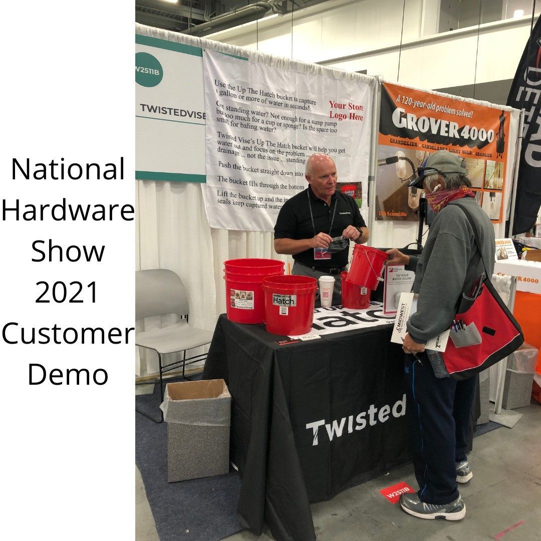 National Hardware Show 2021 demo at Twisted booth, two people talking beside display table