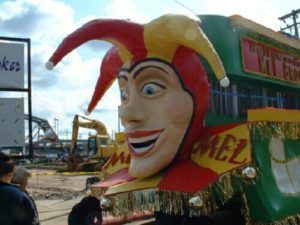 A statue of a jester with mel written on it
