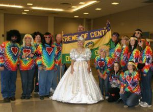 A group of people posing for a picture with a banner that says crew of cent