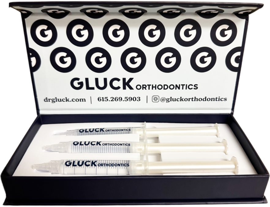 Gluck Orthodontics branded pen set in a white and black presentation box