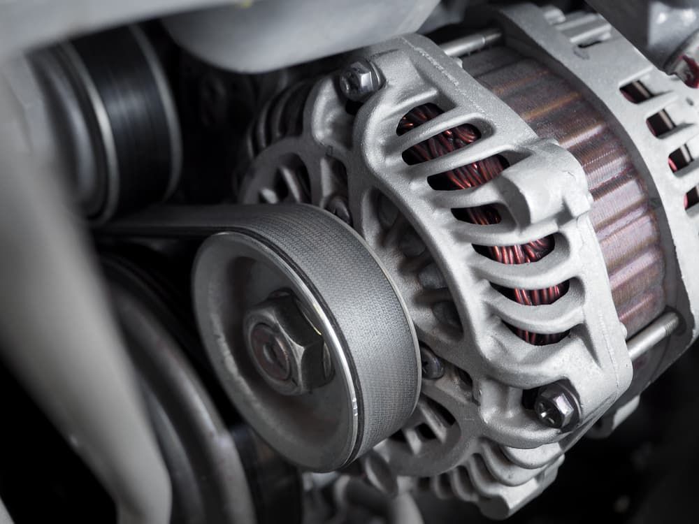 A Close Up of an Alternator in a Car Engine — FNQ Filters & Parts In Mareeba, QLD