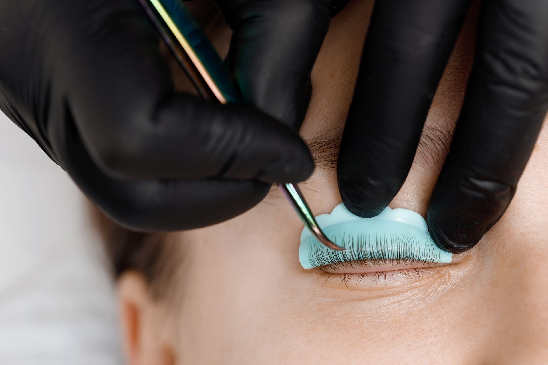 A Woman is Getting a Lash Lift in a Beauty Salon
