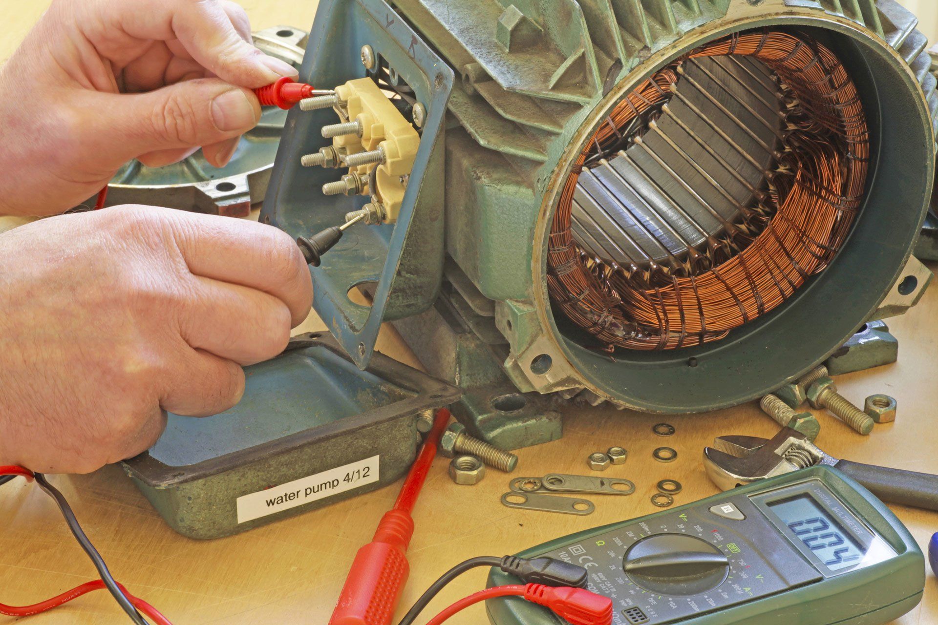person fixing an electric motor