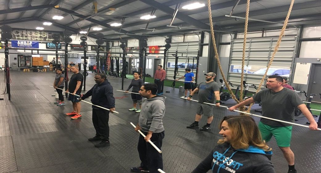 A group of newcomers practicing movements.