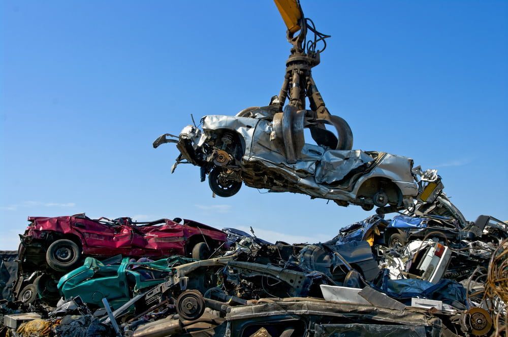 Crane Lifting Crushed Car With Wrecked Vehicles — Fulgi's South Coast Automotive and Dismantling in South Nowra, NSW