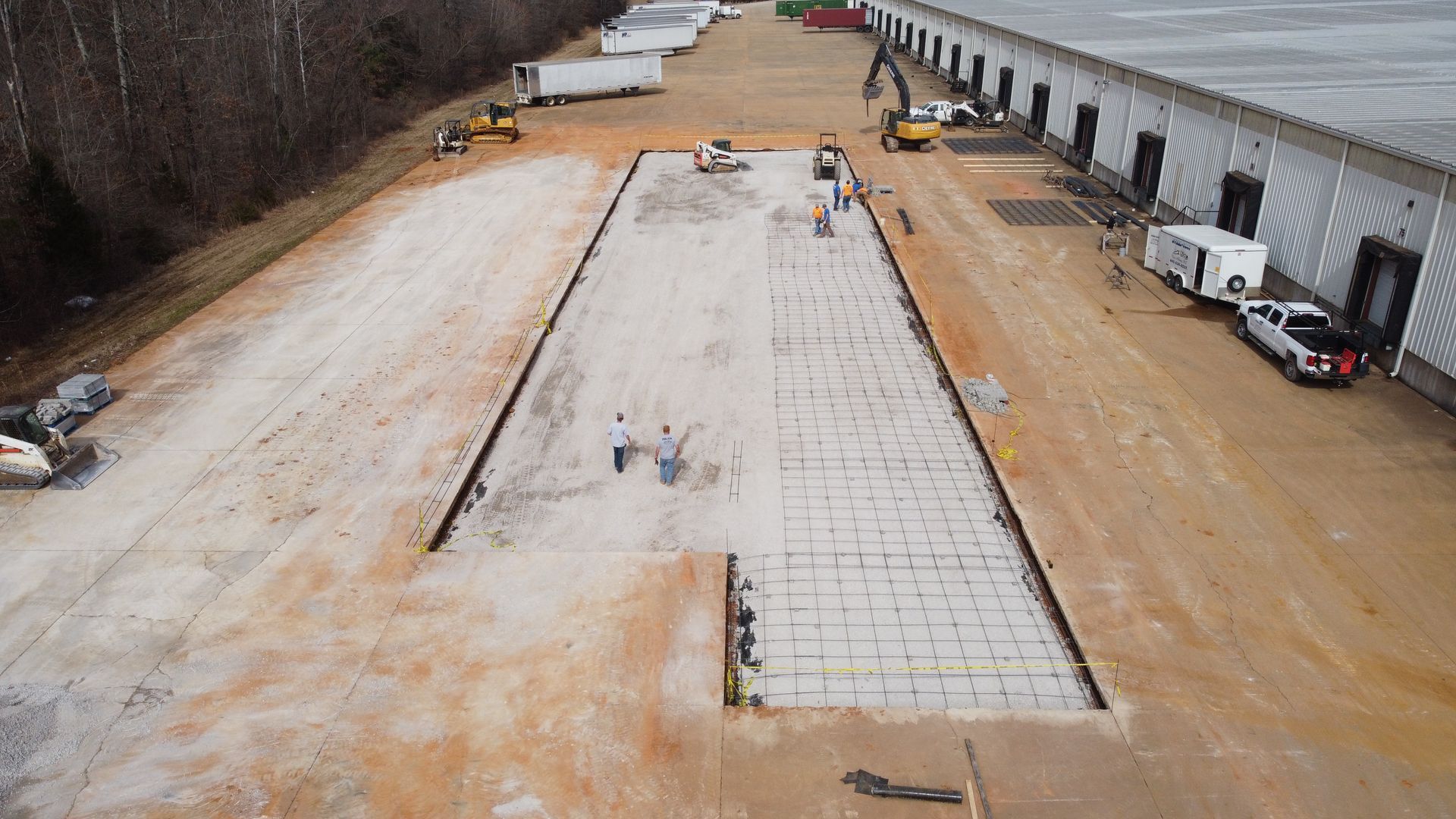 An aerial view of a large warehouse under construction.
