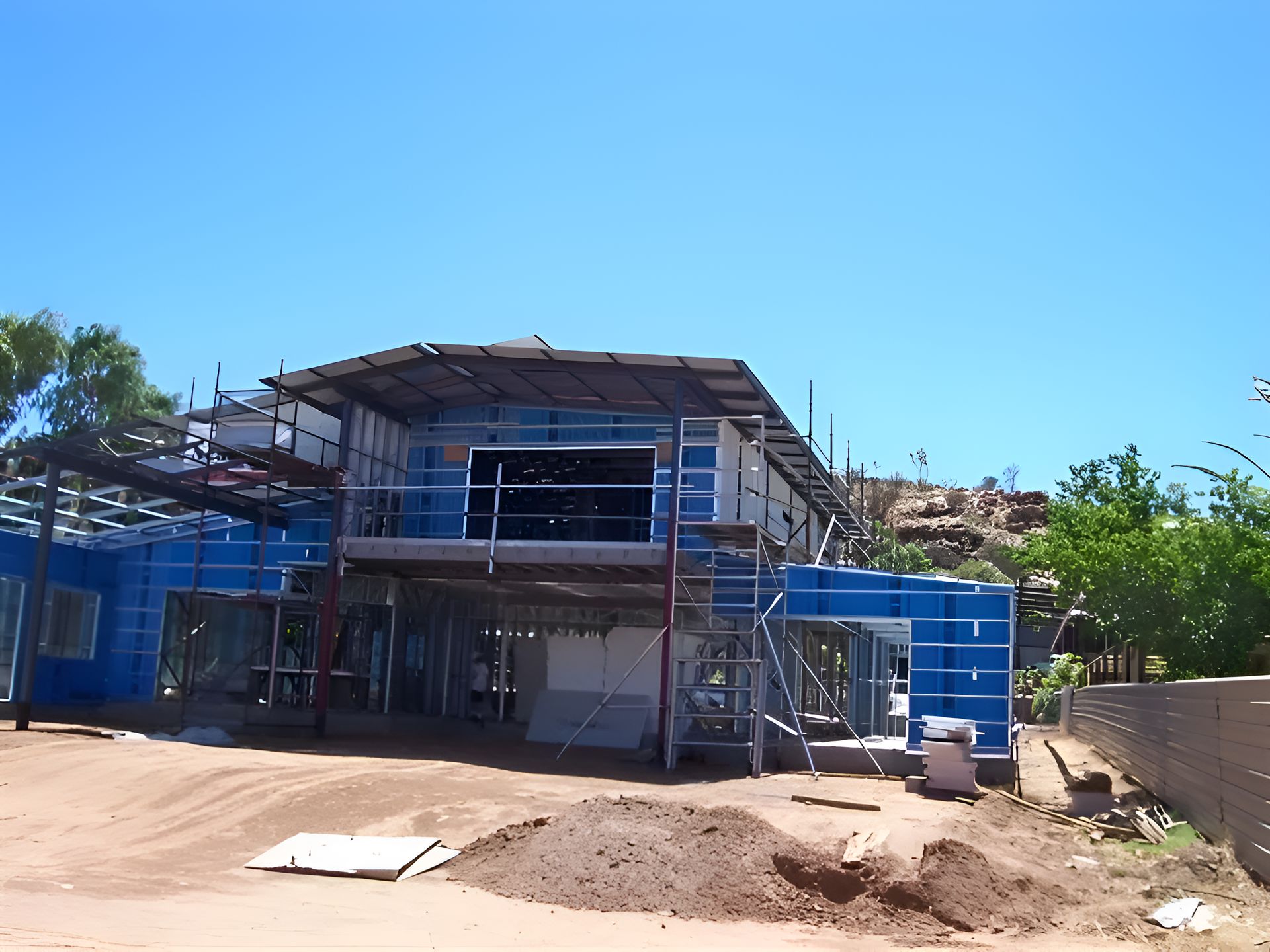 A Building Under Construction With Scaffolding Around It — Sno's Welding In Ciccone, NT