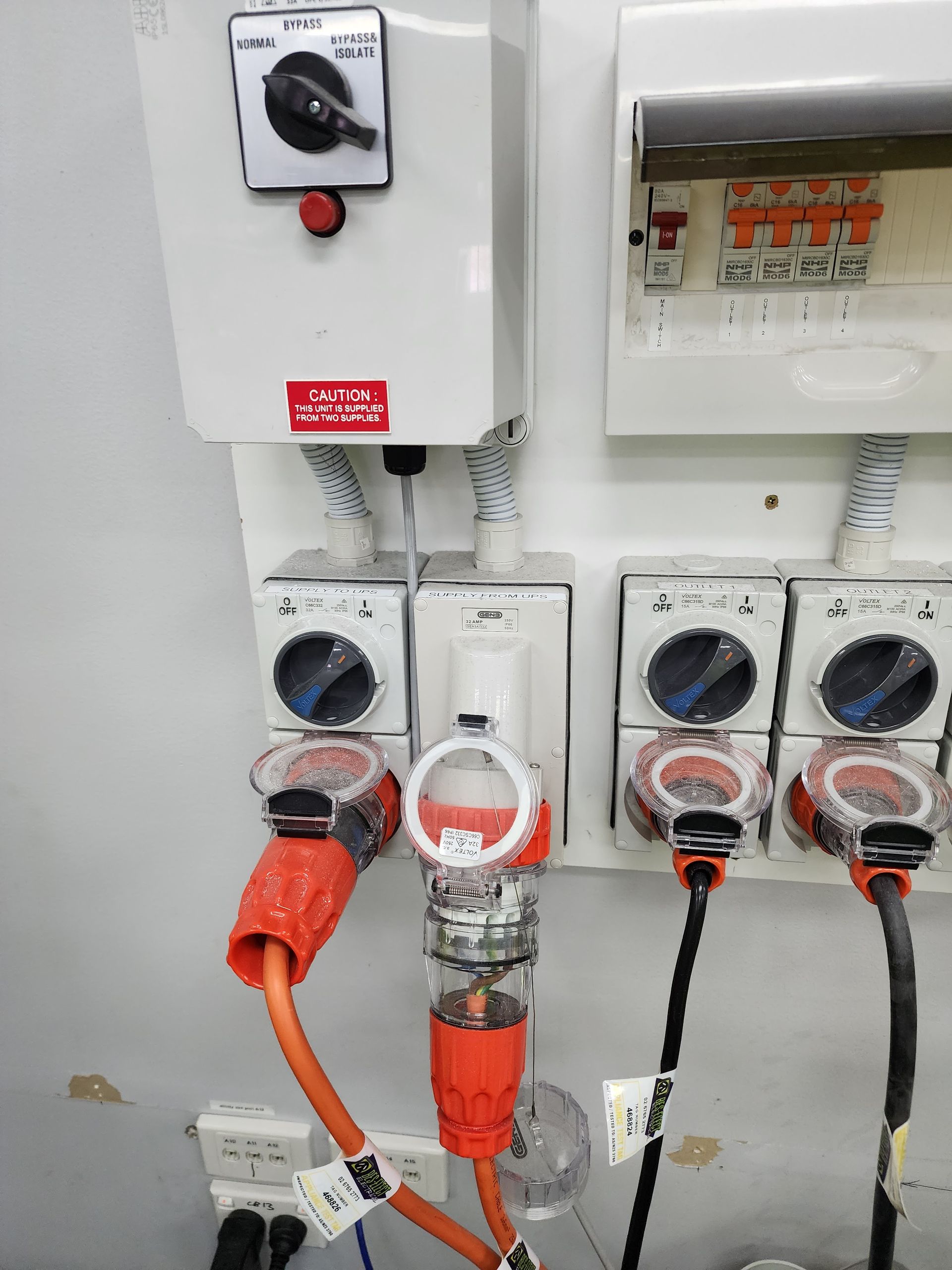 Wall Mounted Electrical Control Boxes and Plugs in A Utility Room — Bes-Elect Electrical in Taminda, NSW