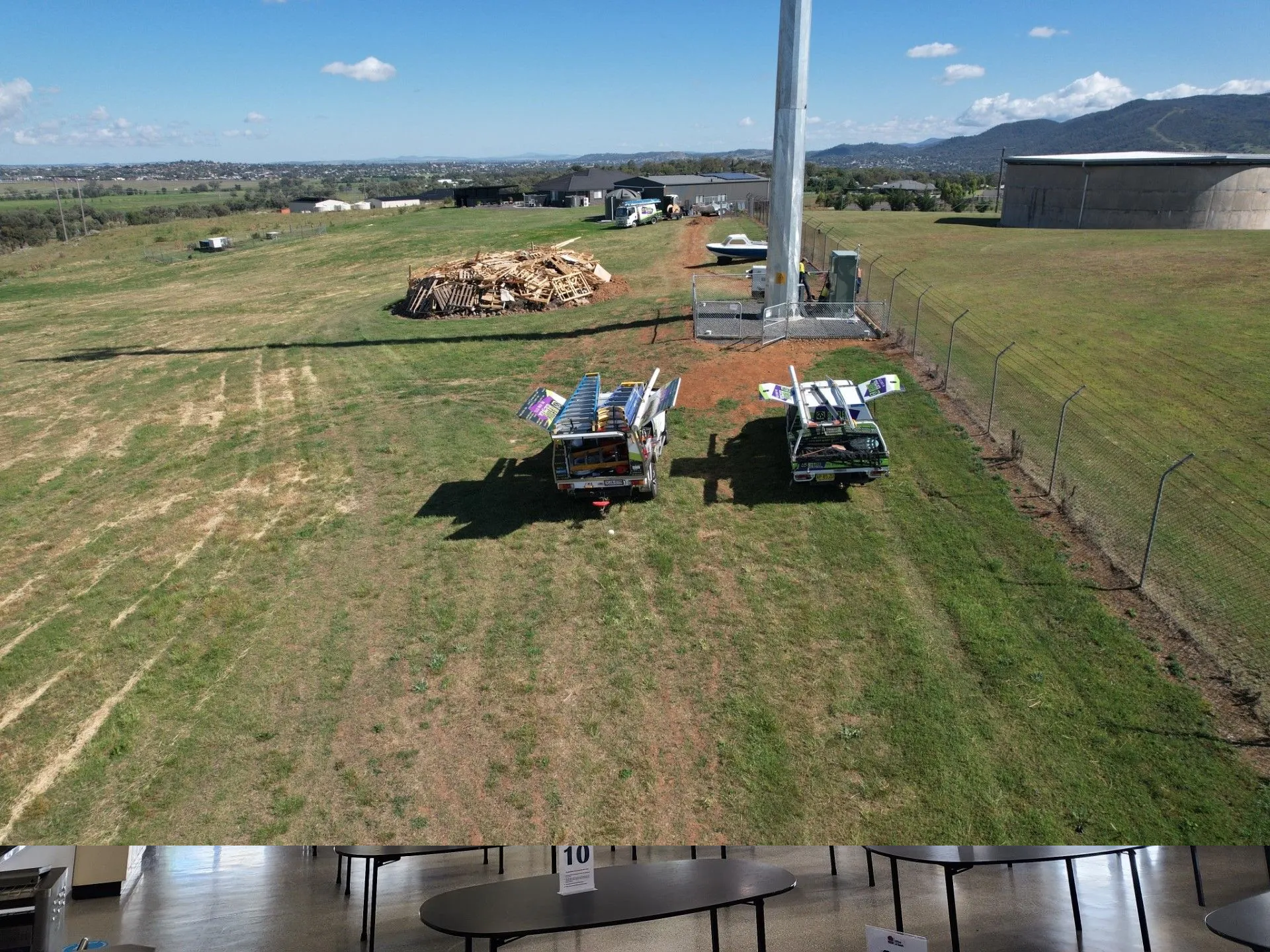 Two Utility Trucks Beside a Tall Pole in A Grassy Field — Bes-Elect Electrical in Taminda, NSW