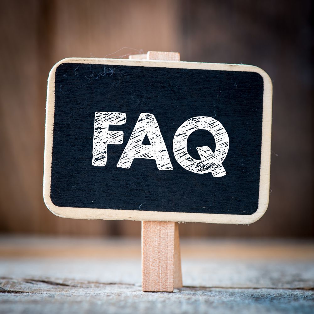 Green Sticky Note With The Word FAQ's Hanging On A Clothes Line — South Burnett Truck Rental In Bundaberg, QLD