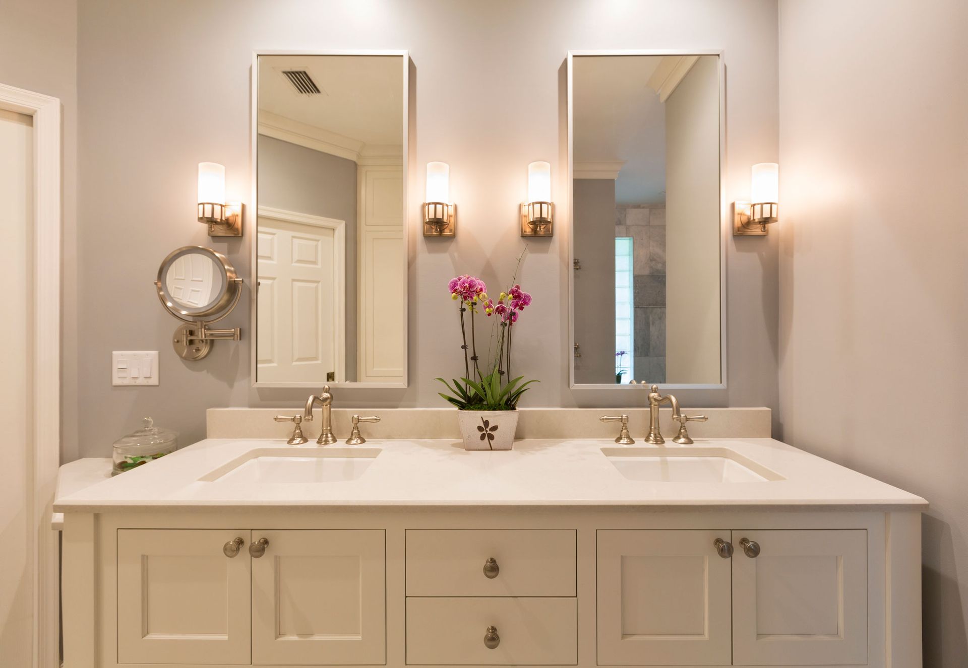 A bathroom with two sinks and two mirrors.