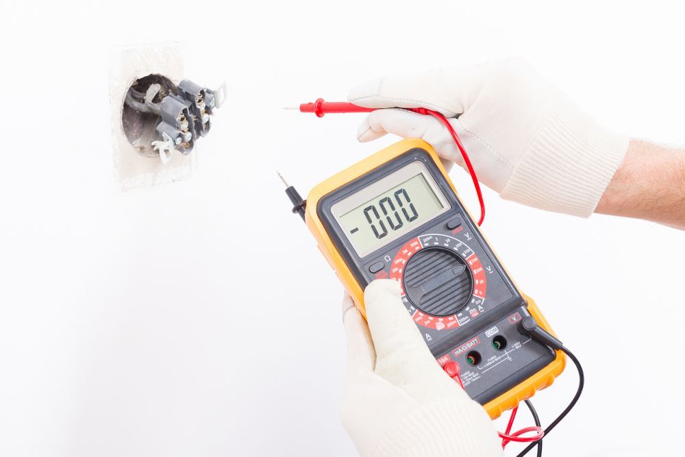 Electrician checking socket voltage — Level 2 Electrician Near Me in Hunter Valley NSW