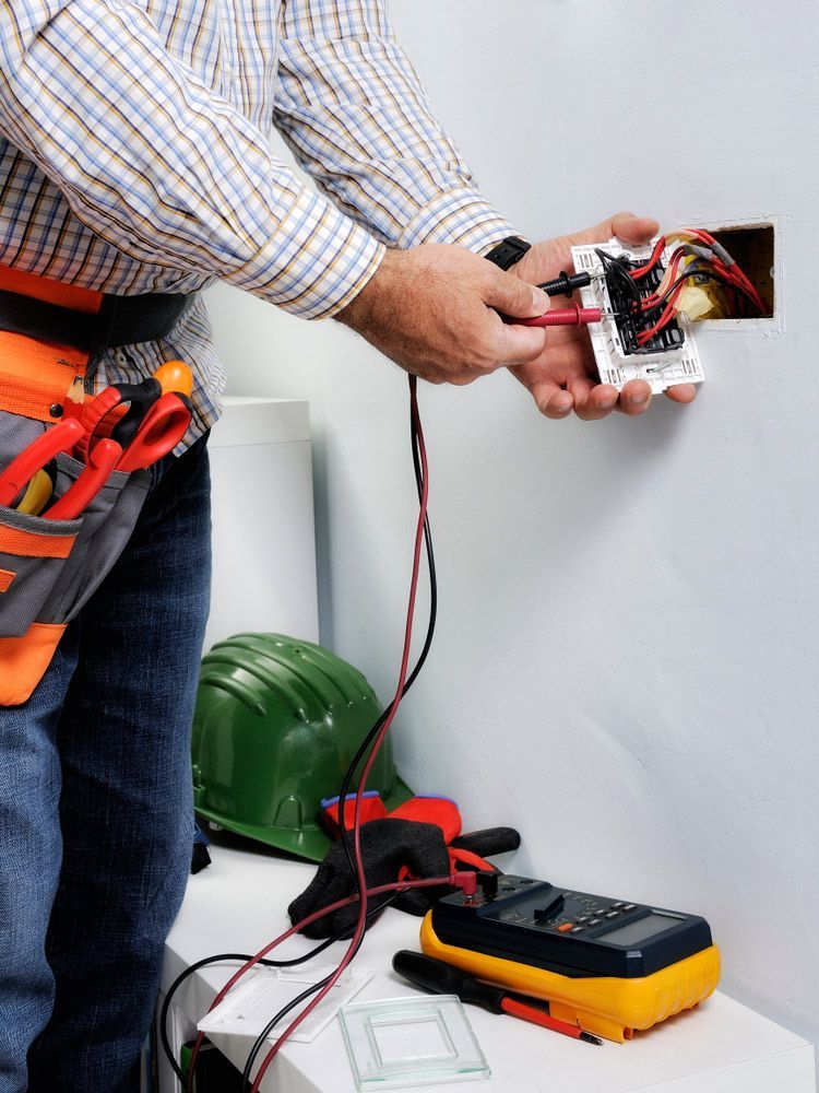 Electrician at work on switches — Level 2 Electrician ASP in Sawyers Gully NSW