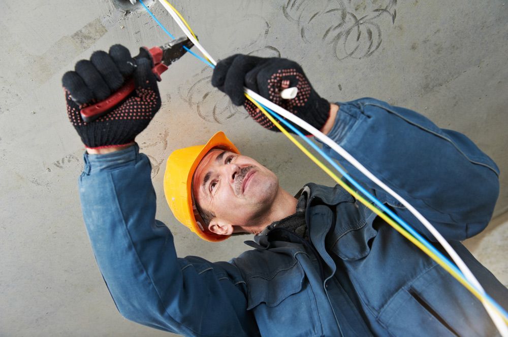 One electrician working with cable mounting — Electrician in Sawyers Gully NSW