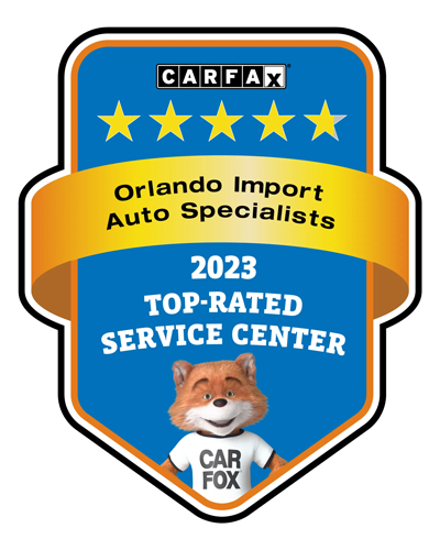 CARFAX 2023 Top-Rated Service Center award badge, blue and gold, with cartoon fox mascot.