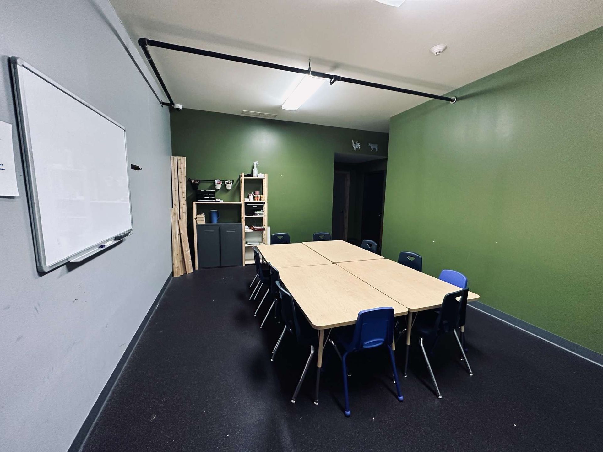A conference room with a long table and chairs
