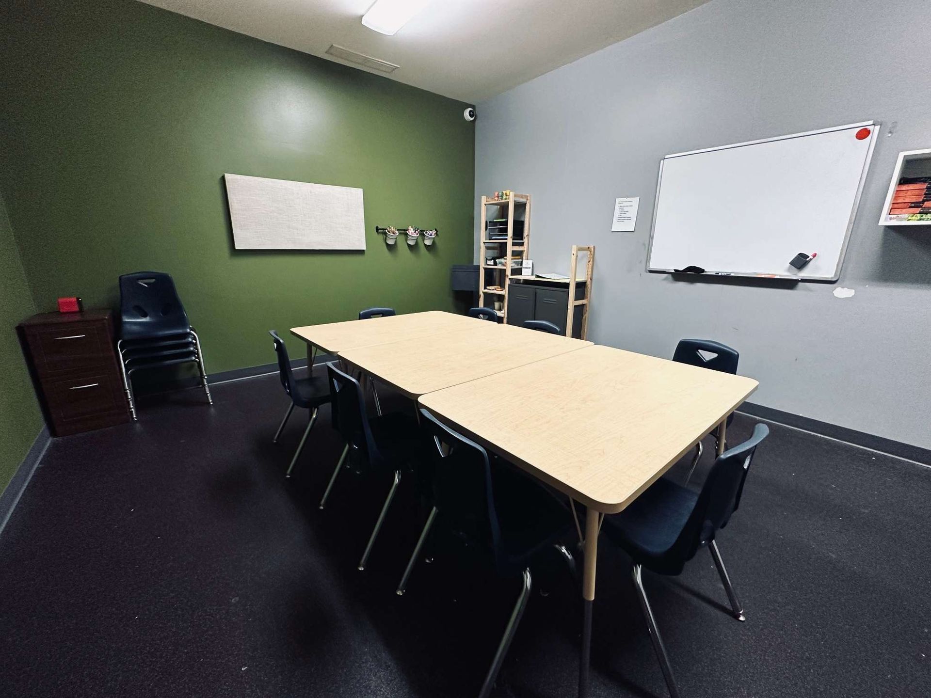 A conference room with a long table and chairs