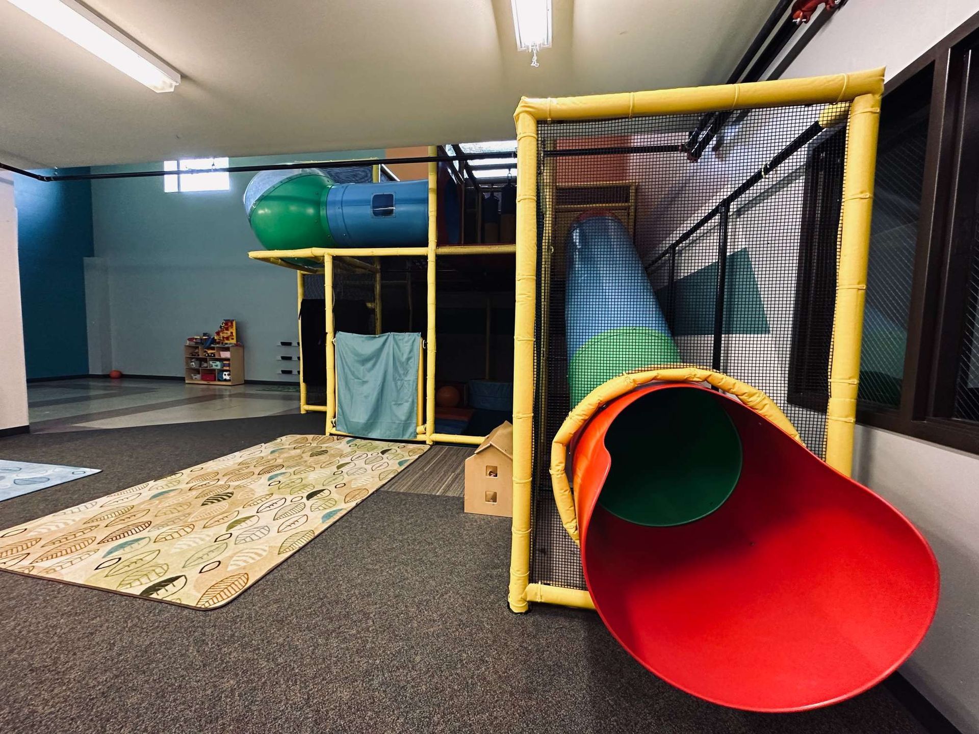 There is a slide in the middle of the room.