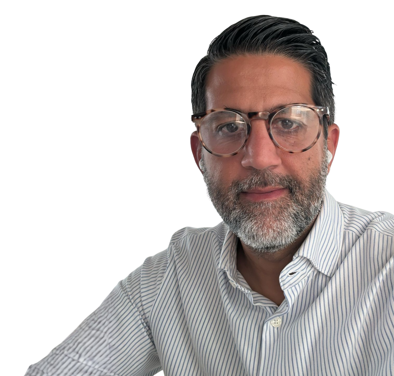 Josean wearing a black blazer and white shirt, smiling, with a pocket square.