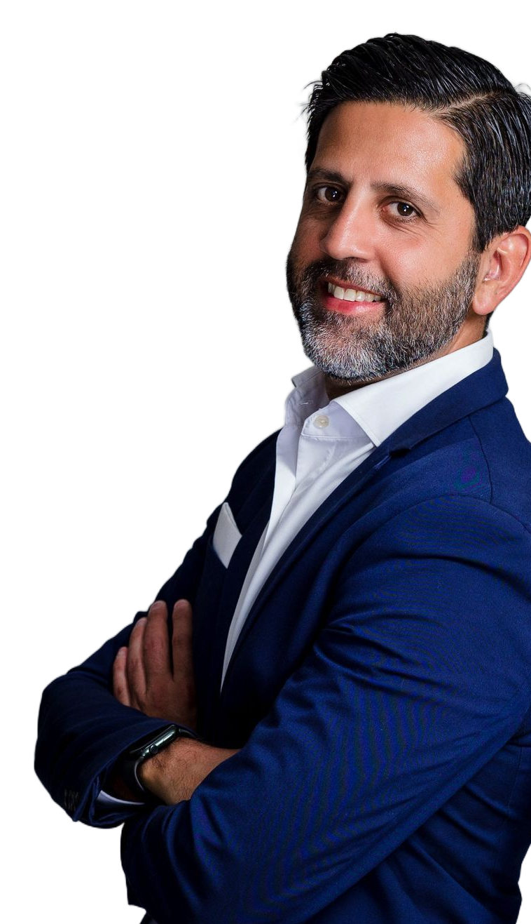 Smiling man in a blue blazer with arms crossed on a white background