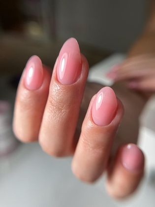 Glossy soft pink almond-shaped manicure at Simply Irresistible Nail Salon in DeLand, FL