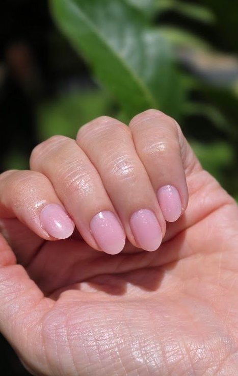 Soft pink, glossy natural nails with a soft gel overlay at Simply Irresistible Nail Salon in DeLand, FL.