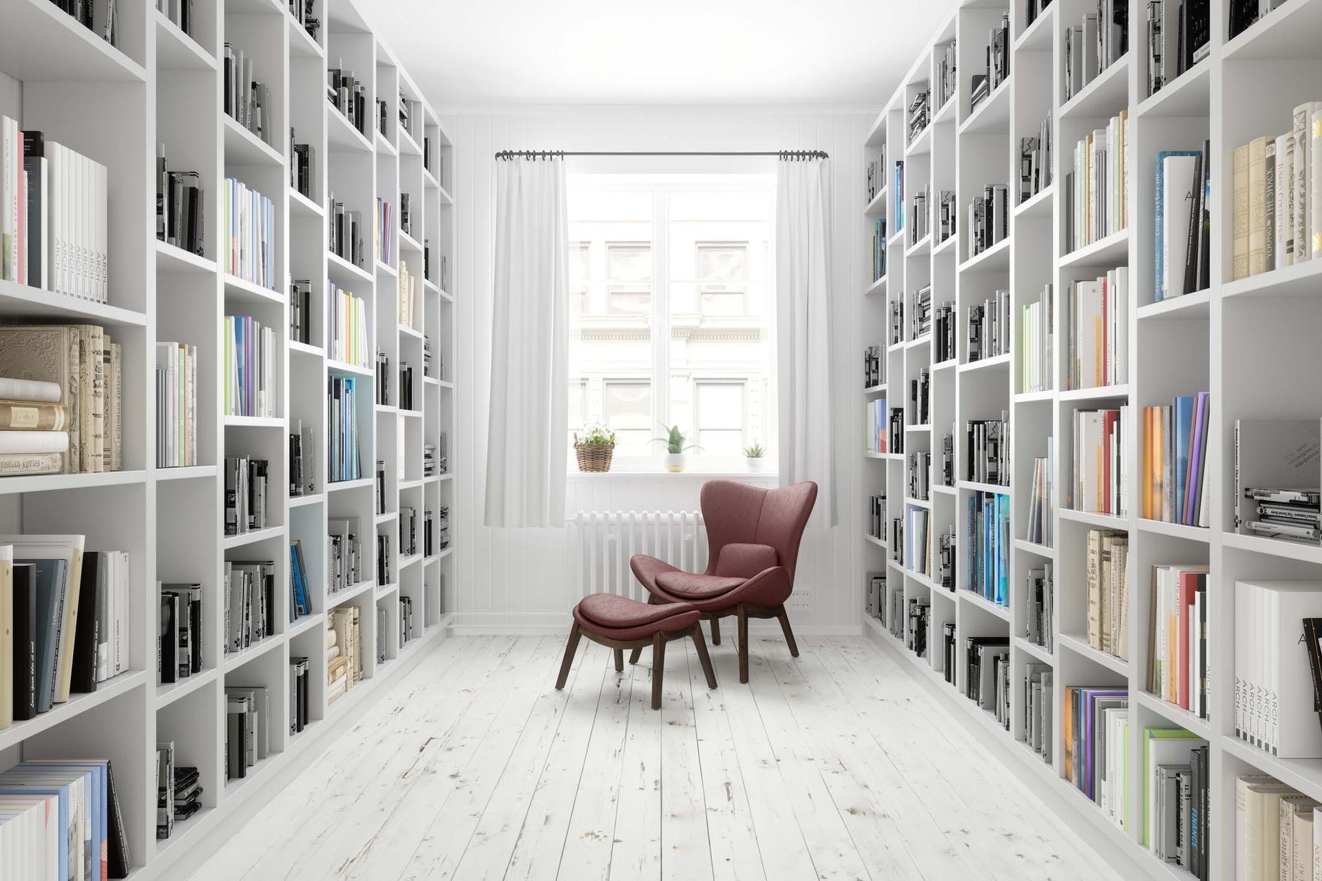 A library filled with lots of books and a chair.