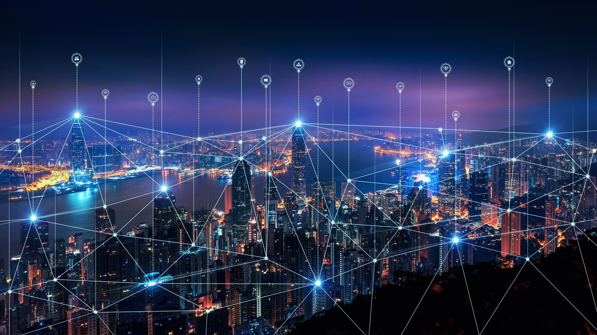 Nighttime cityscape with illuminated buildings connected by glowing network lines and location pins.