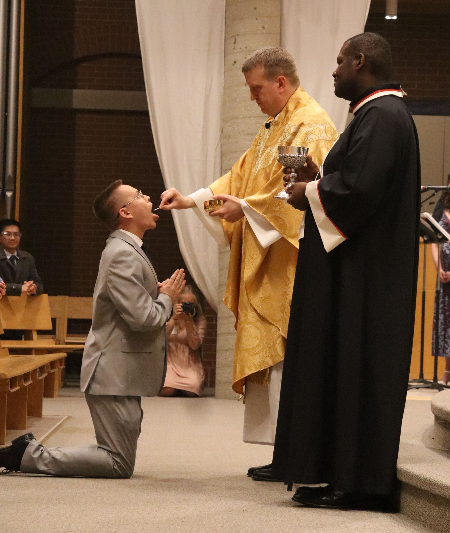 a student receiving holy communion for the first time