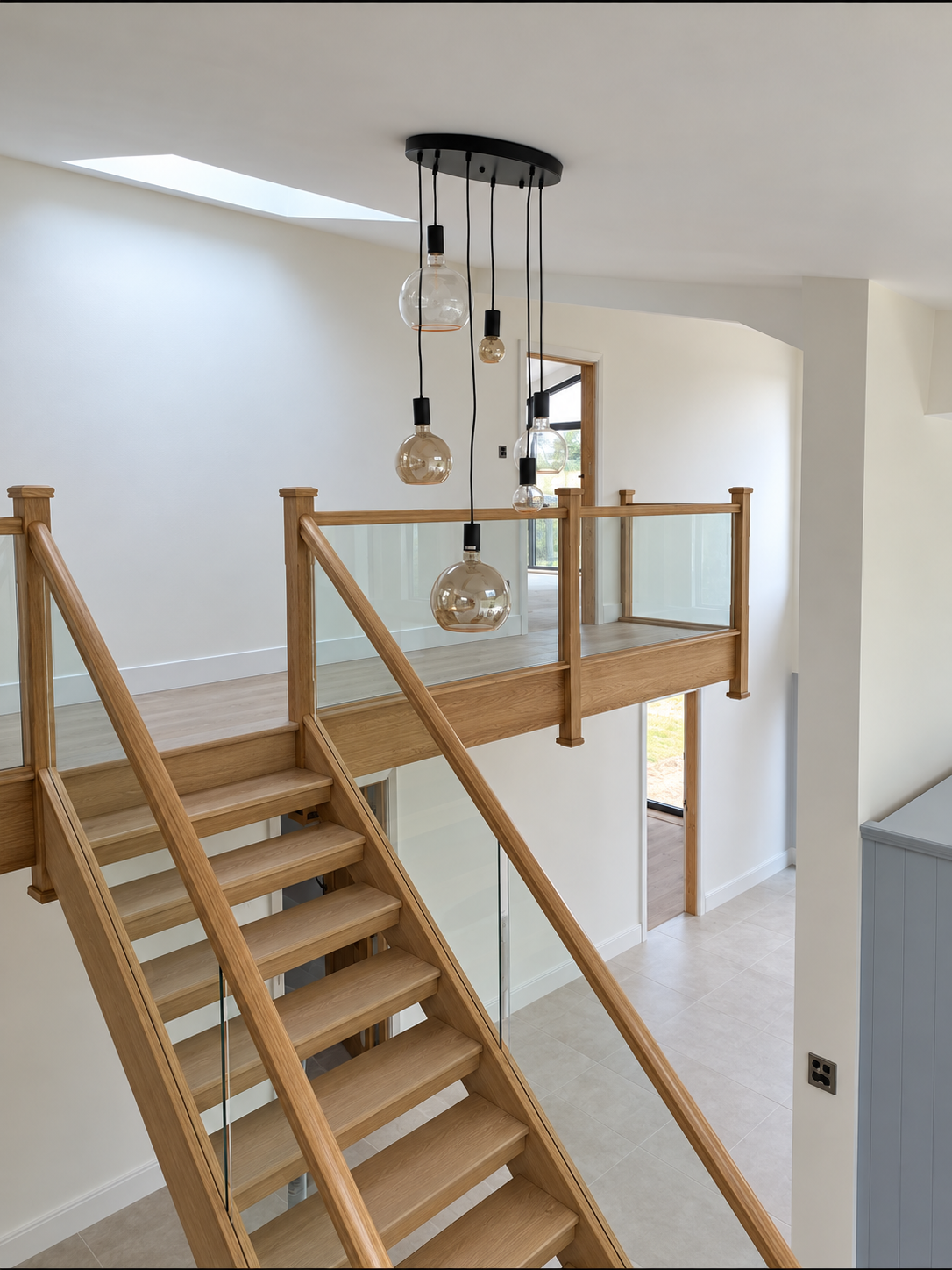 Bespoke oak replacement staircase with open treads and glass balustrade